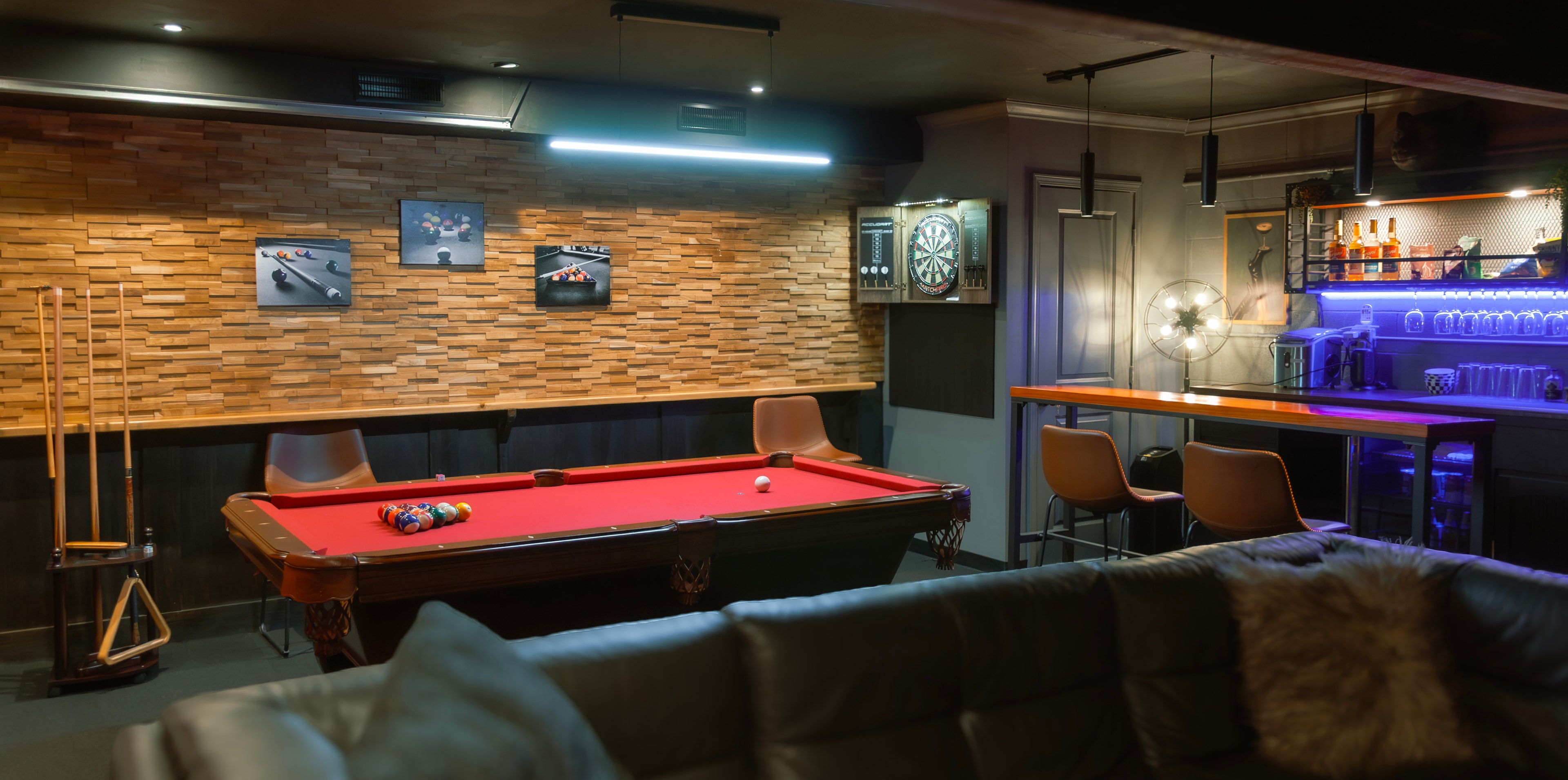 Game Room — pool table, dartboard, and cocktail bar with blue LED lighting